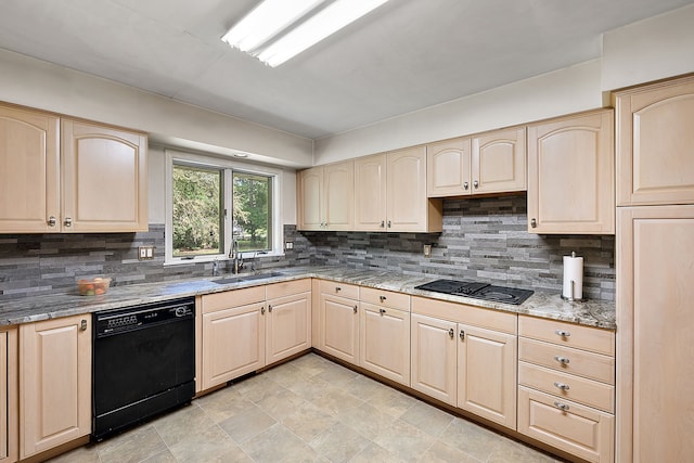 kitchen featuring black appliances, backsplash, light brown cabinets, and sink