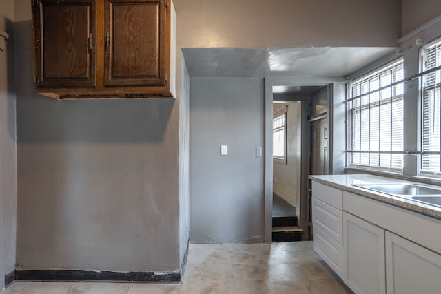 kitchen featuring white cabinets