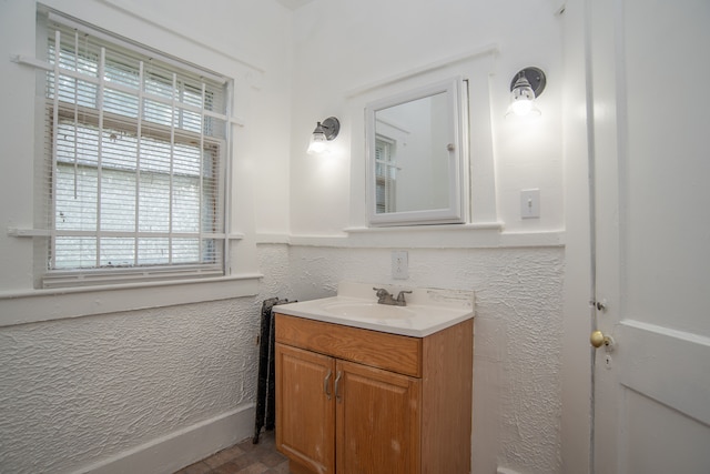 bathroom with vanity and a healthy amount of sunlight