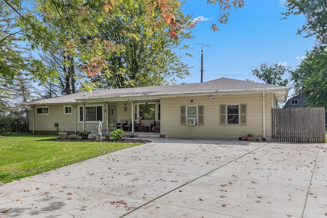 back of house with a porch and a lawn