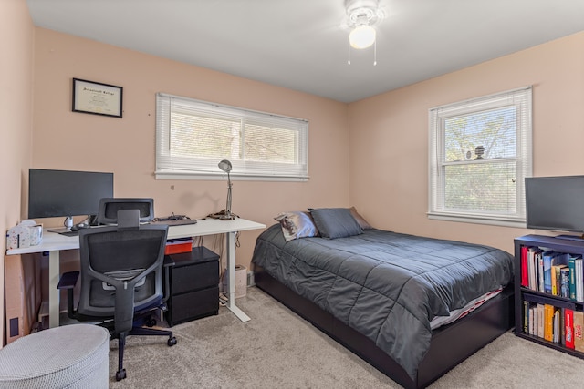 bedroom featuring light carpet