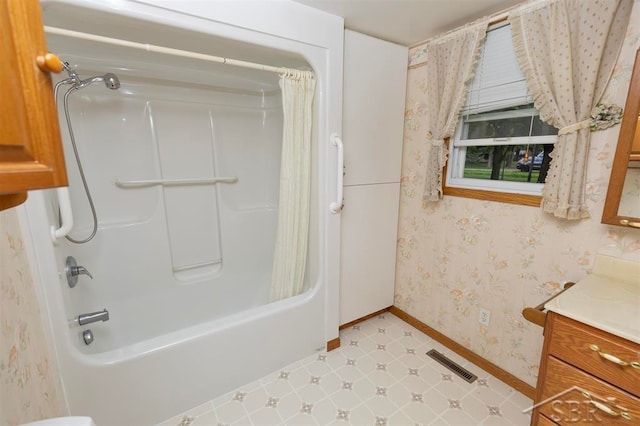 bathroom featuring shower / bath combination with curtain and vanity