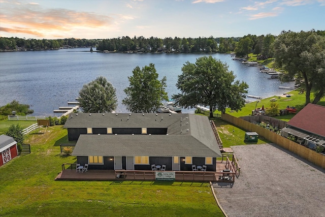 aerial view at dusk with a water view