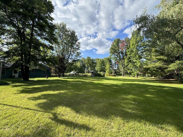 5490 S Harrison Rd, Houghton Lake, MI 48629 - view of green lawn