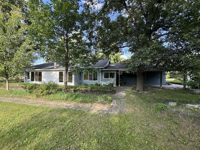 5490 S Harrison Rd, Houghton Lake, MI 48629 - single story home with an attached carport