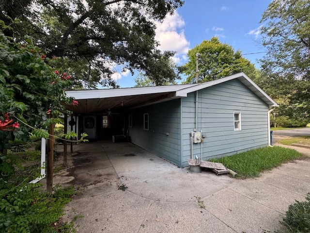 view of property exterior featuring a carport