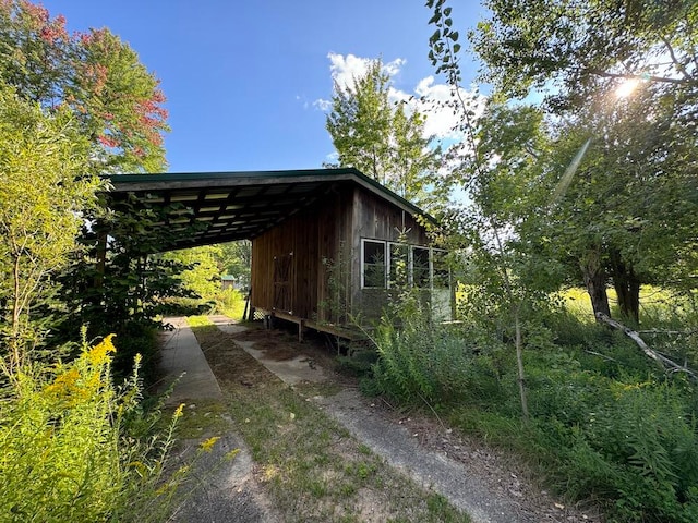 view of side of property featuring a carport