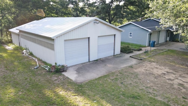 garage featuring a lawn