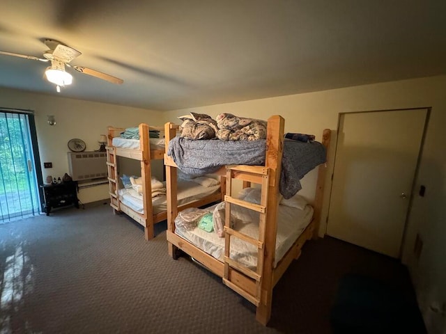 bedroom with dark colored carpet and ceiling fan