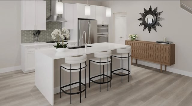 kitchen with wall chimney exhaust hood, hanging light fixtures, a kitchen island with sink, and appliances with stainless steel finishes