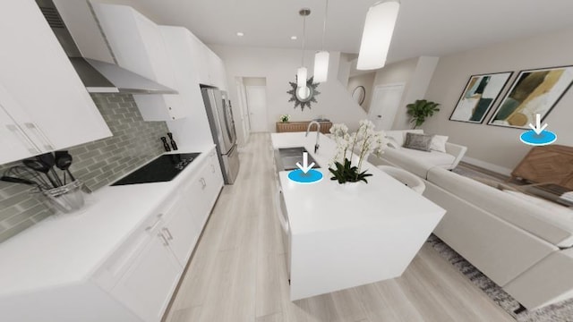 kitchen featuring tasteful backsplash, white cabinetry, and hanging light fixtures