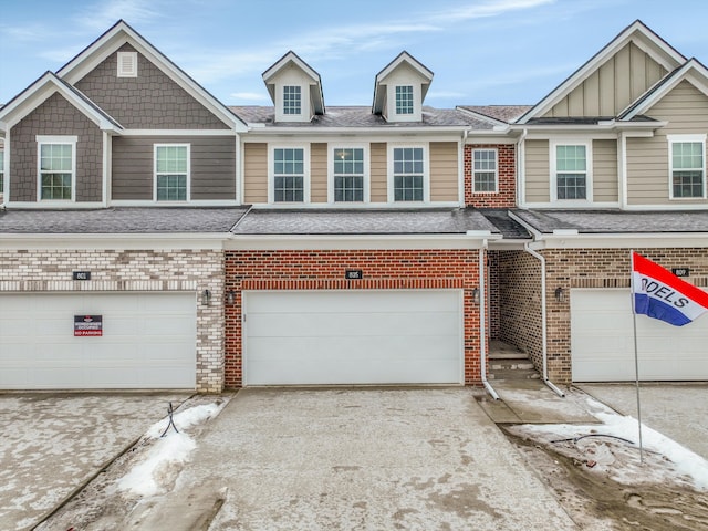 townhome / multi-family property featuring a garage