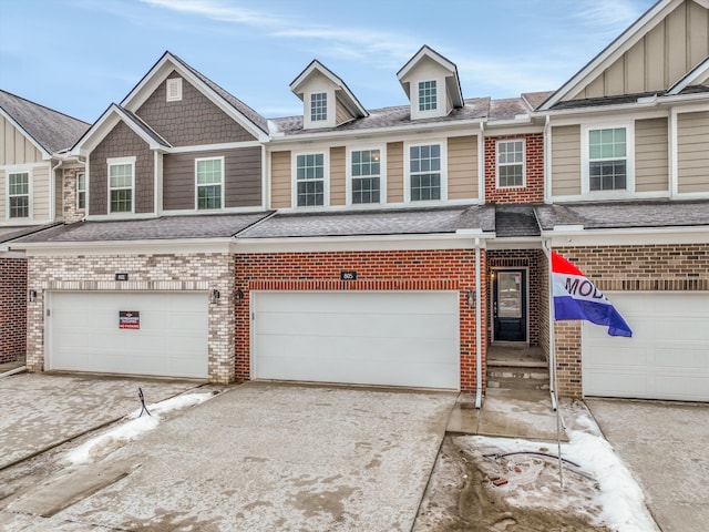 townhome / multi-family property featuring a garage