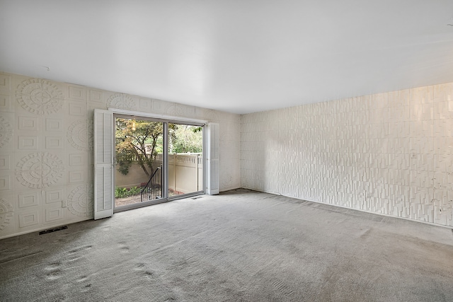 unfurnished room featuring carpet flooring