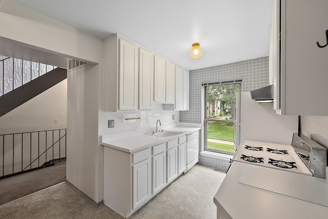 kitchen with sink, ventilation hood, white appliances, white cabinets, and tile walls