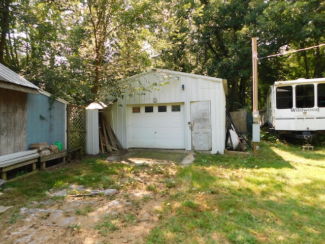 garage with a yard