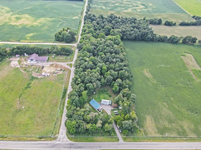 birds eye view of property with a rural view