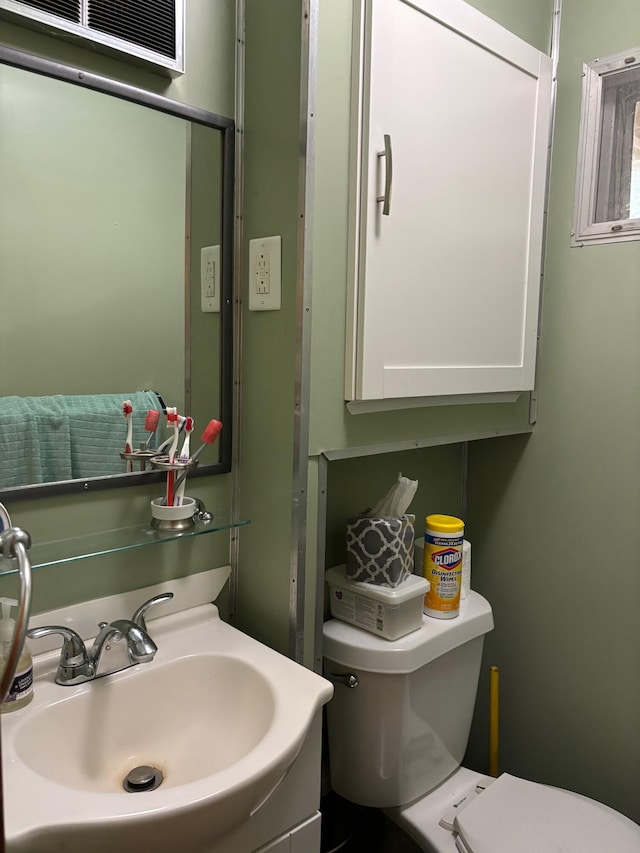 bathroom with sink and toilet