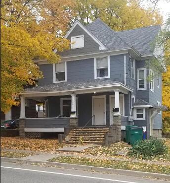 1408 E Main St, Kalamazoo, MI 49048 - traditional style home with a porch and roof with shingles