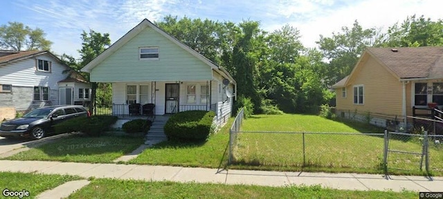 bungalow-style house with a porch and a front yard