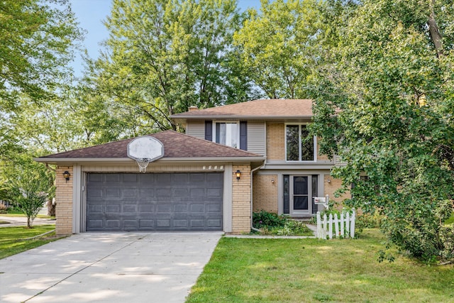 view of front of property featuring a garage and a front lawn