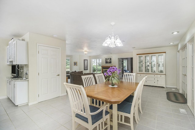 29100 Heritage Ln, Paw Paw, MI 49079 - dining area featuring light tile patterned flooring, a chandelier, and recessed lighting