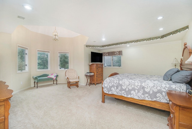 carpeted bedroom featuring an inviting chandelier