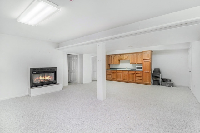 29100 Heritage Ln, Paw Paw, MI 49079 - living area featuring a glass covered fireplace and light carpet