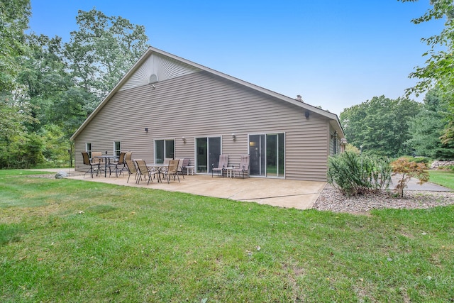 rear view of property with a patio area and a yard