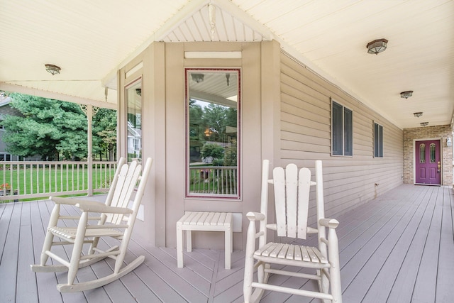 wooden terrace featuring a porch