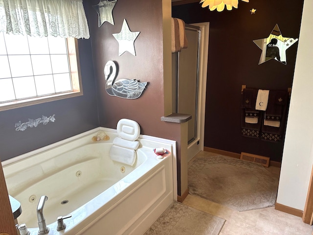 bathroom featuring independent shower and bath and tile patterned floors