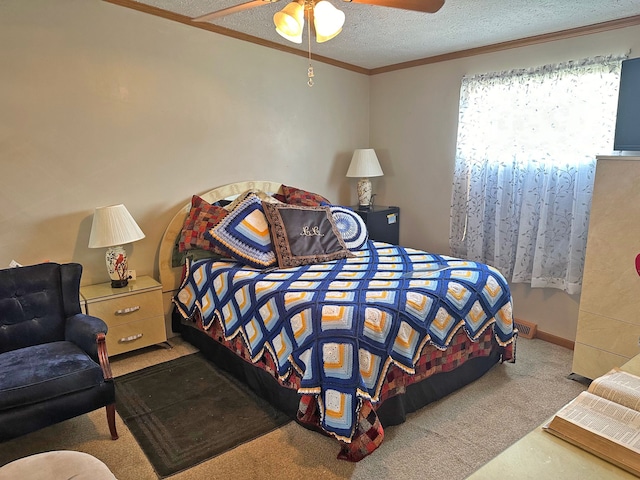 bedroom featuring ornamental molding, carpet floors, ceiling fan, and a textured ceiling