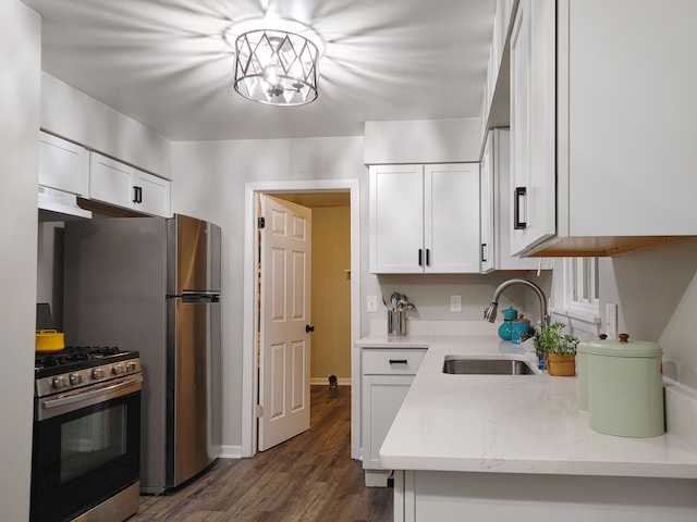 kitchen featuring sink, white cabinets, extractor fan, and stainless steel range with gas stovetop