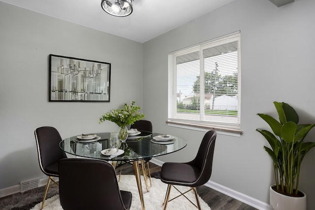 dining area with wood-type flooring