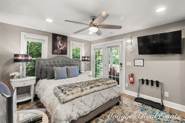 bedroom featuring wood-type flooring, access to outside, and ceiling fan