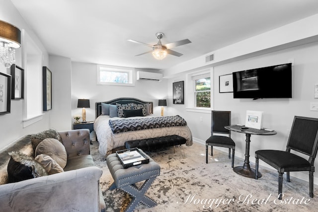 bedroom featuring an AC wall unit, multiple windows, and ceiling fan