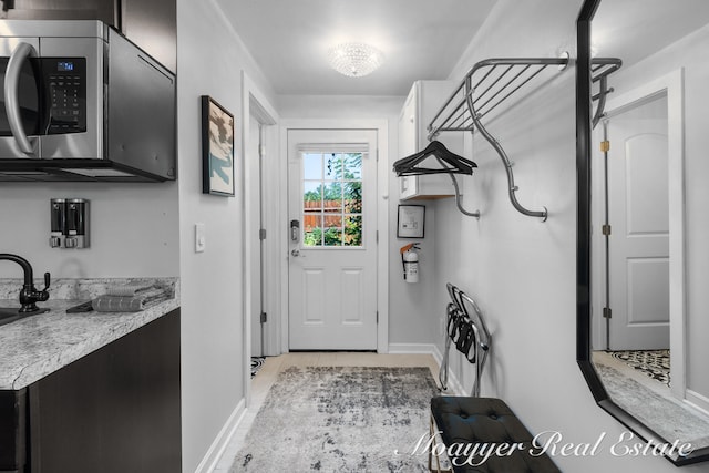 doorway featuring sink