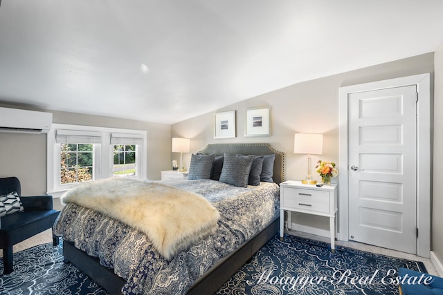 bedroom featuring dark colored carpet, lofted ceiling, and a wall mounted AC