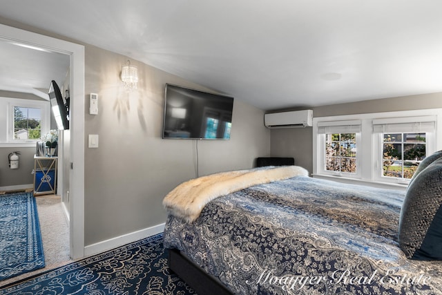 bedroom featuring a wall mounted air conditioner and carpet flooring