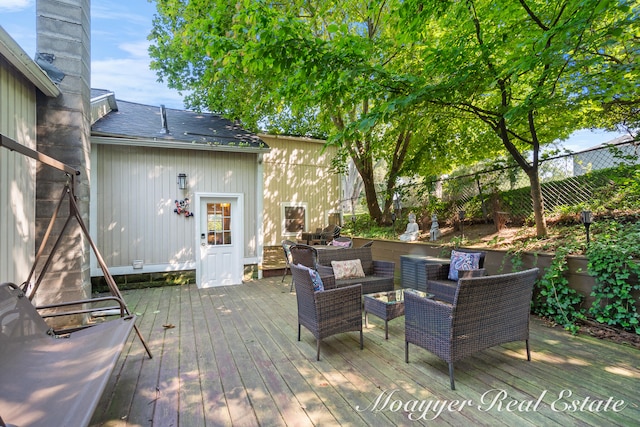 wooden terrace featuring outdoor lounge area