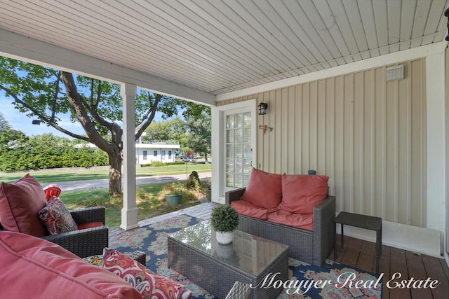 sunroom / solarium featuring wood ceiling