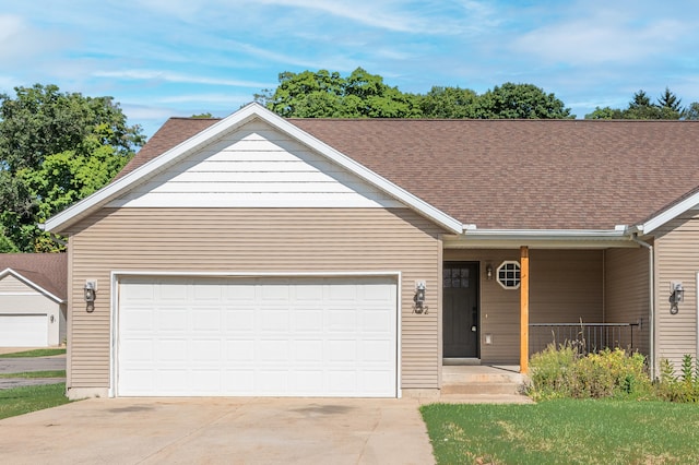 single story home featuring a porch and a garage