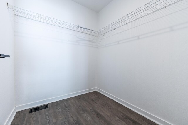 722 Tioga Park Unit 722, Big Rapids, MI 49307 - walk in closet featuring dark wood-style floors