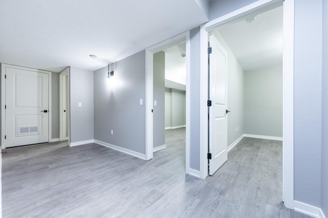 empty room with light hardwood / wood-style floors