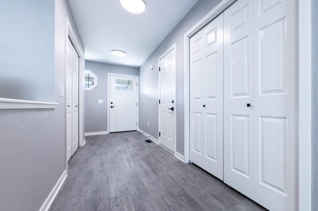 doorway featuring dark hardwood / wood-style floors