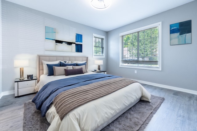 bedroom with hardwood / wood-style flooring