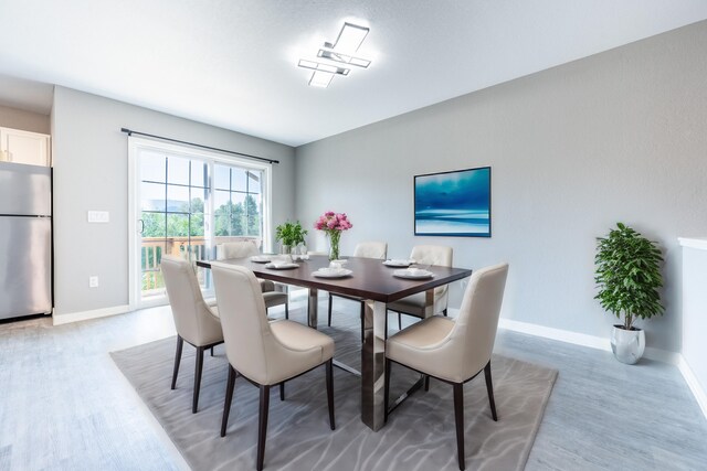 722 Tioga Park Unit 722, Big Rapids, MI 49307 - dining area featuring light wood finished floors and baseboards