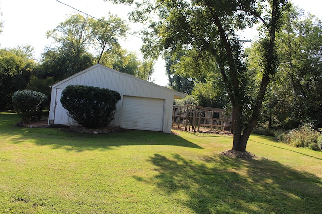 exterior space featuring a garage and an outdoor structure