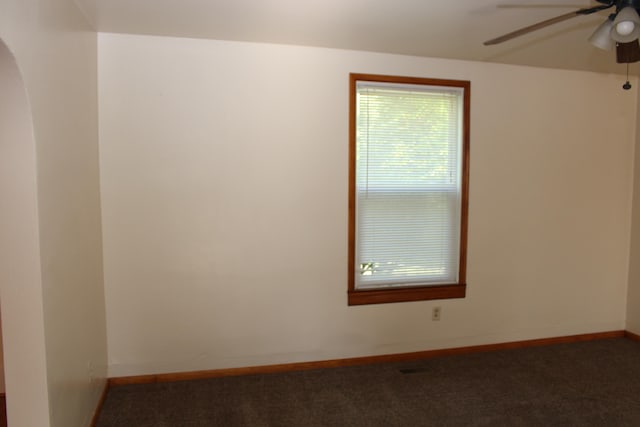 spare room with carpet and ceiling fan