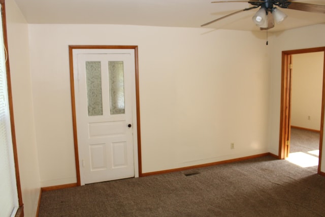 empty room with carpet and ceiling fan